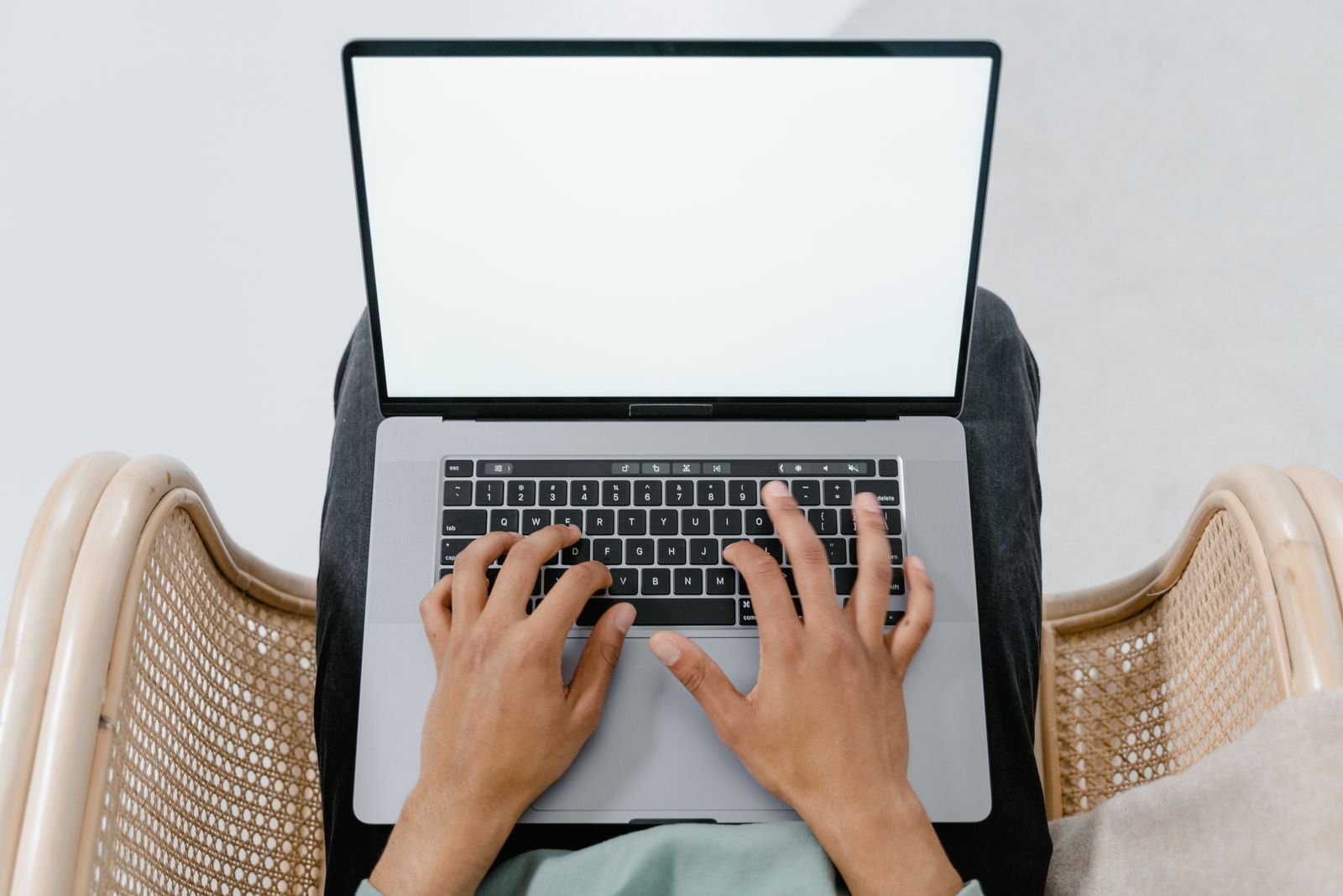 Typing a prompt into a laptop