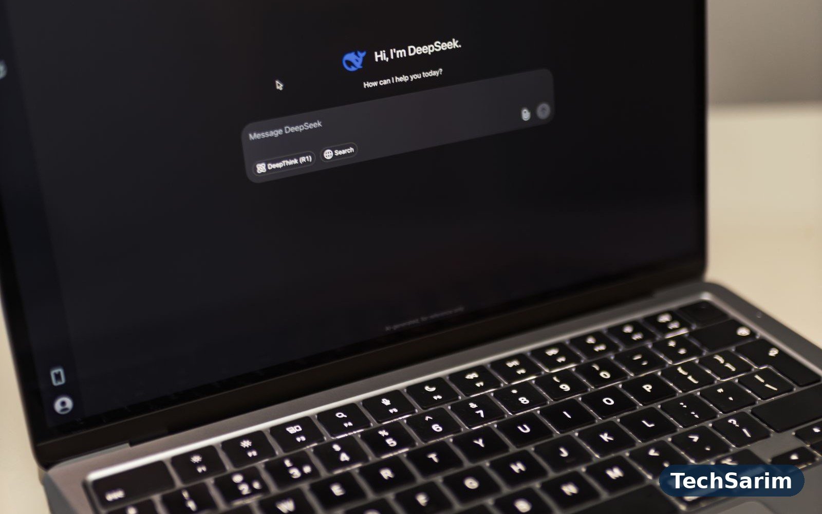 Close-up of a laptop screen showing an AI chat conversation