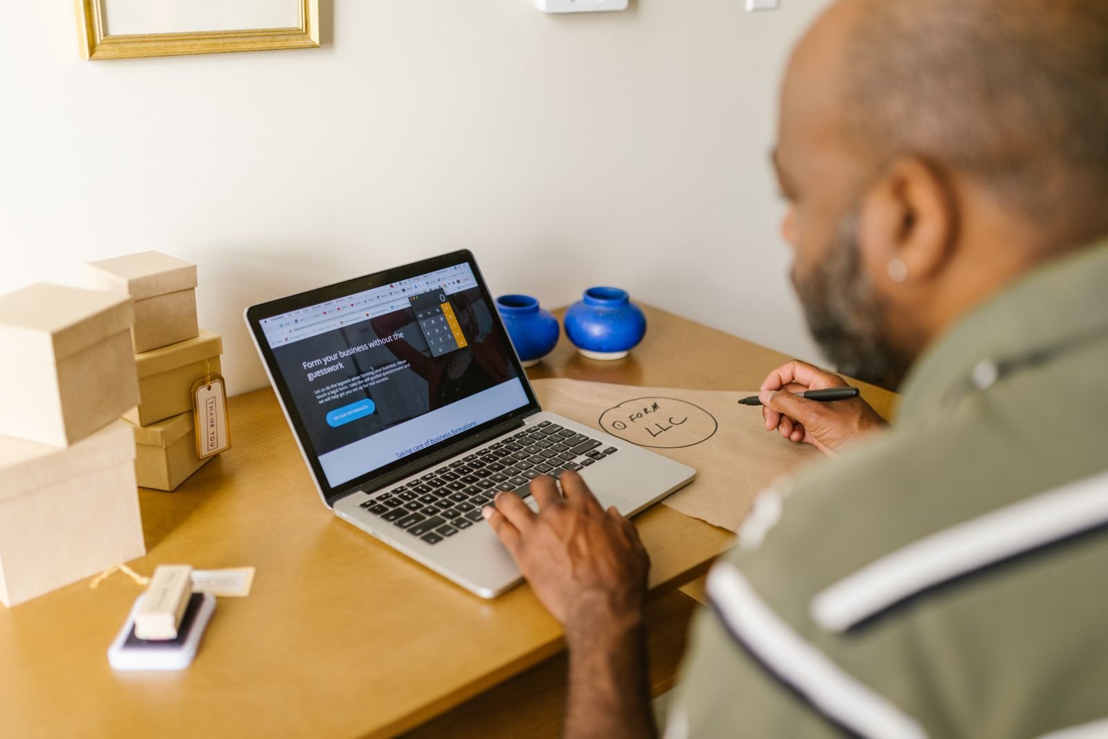 Entrepreneur at a desk using a laptop for business planning