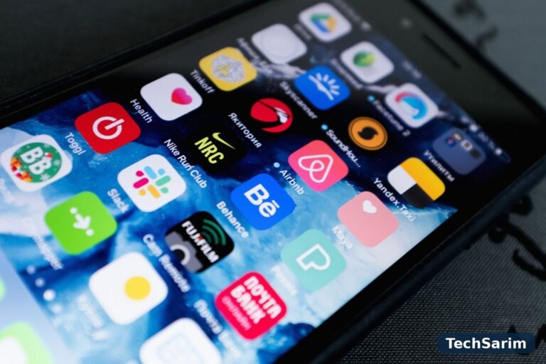 A smartphone home screen filled with colourful app icons, including Slack, Airbnb and Nike Run Club