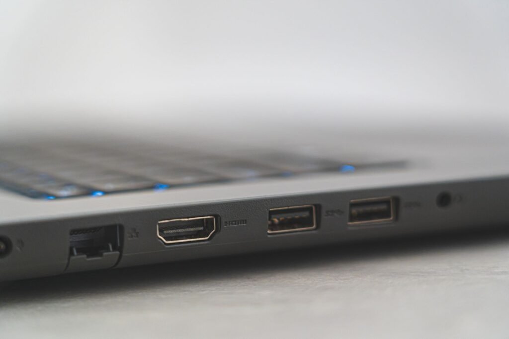 Close-up of the side of a laptop showing an Ethernet port, an HDMI port, two USB ports and a headphone jack